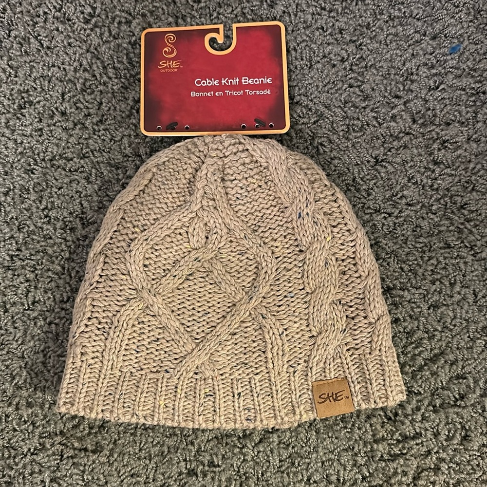 Never been worn She beanie with tags.